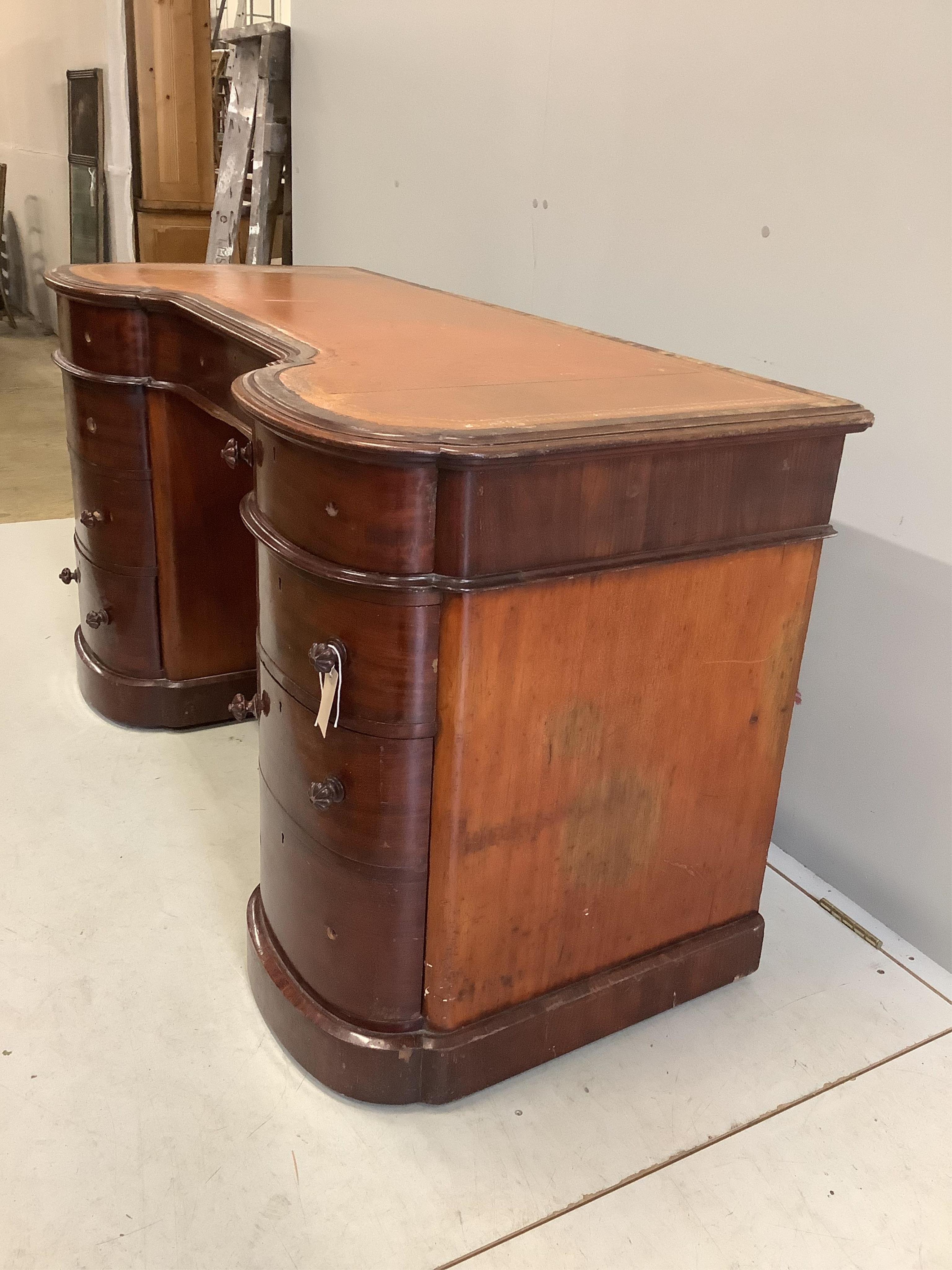 A Victorian mahogany bow front pedestal desk, width 138cm, depth 62cm, height 76cm. Condition - poor